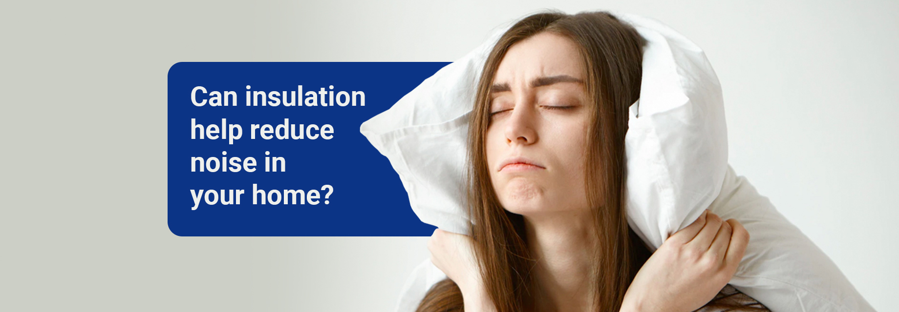Frustrated woman with a pillow blocking out noise, searching for soundproof insulation resources.
